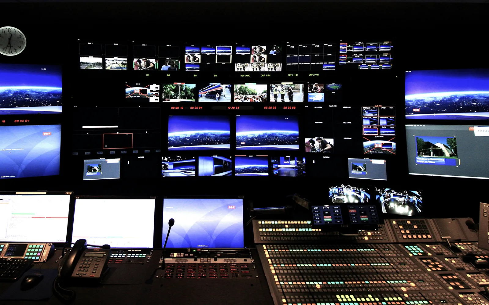 Multiple CCTV monitors lined up in a control center
